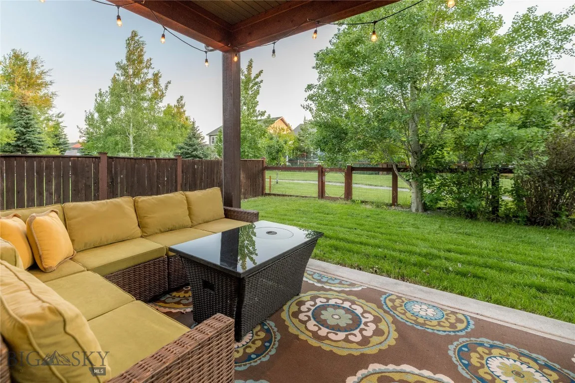 Covered outdoor patio leading to community trail.