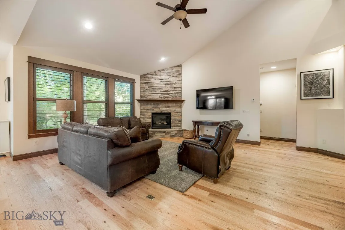 Vaulted ceilings, wood blinds and hardwood floors