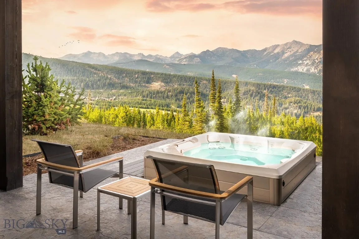 Photo of hot tub and view in similar unit.