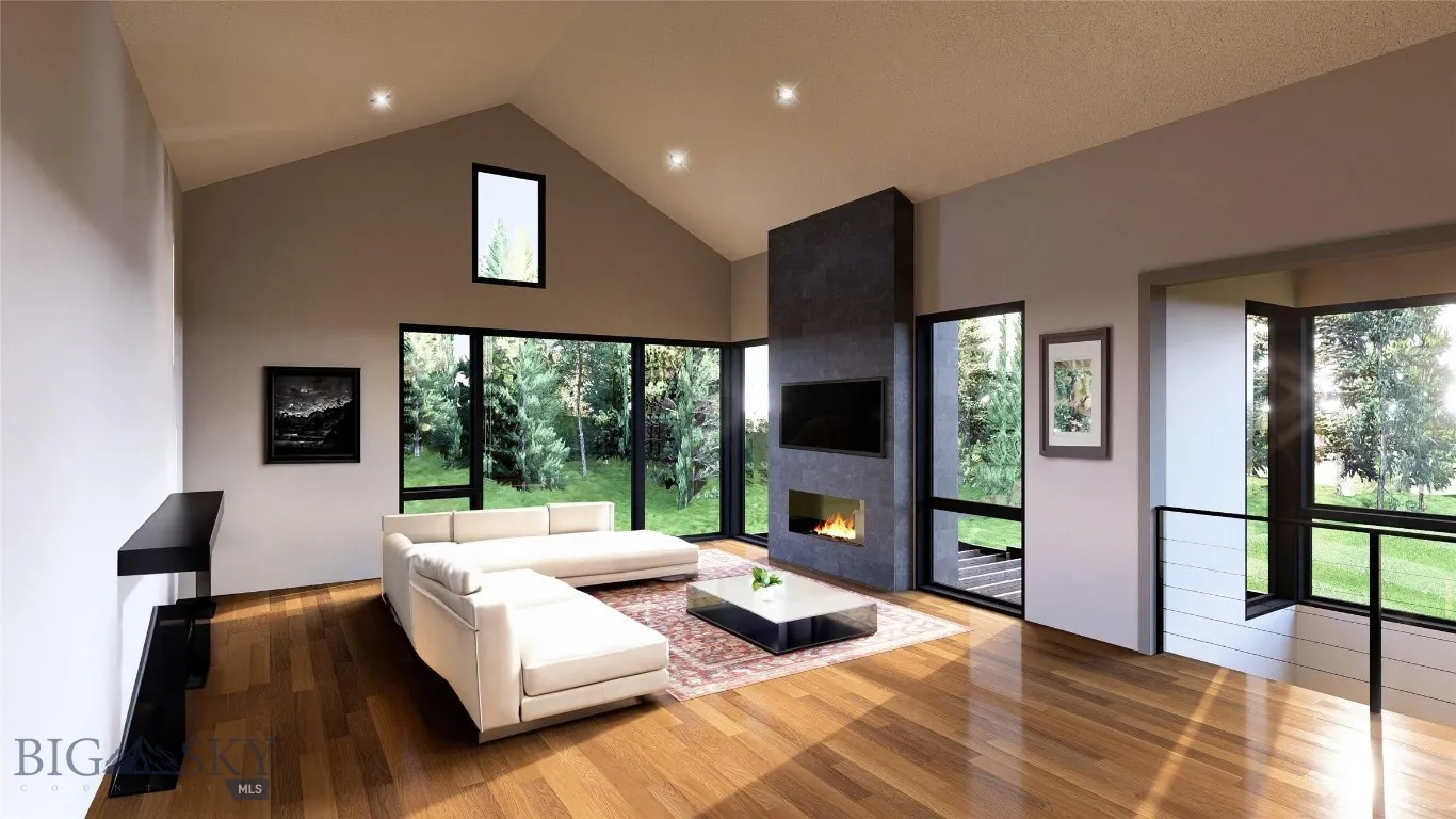 Living room featuring a large fireplace, high vaulted ceiling, and hardwood / wood-style flooring