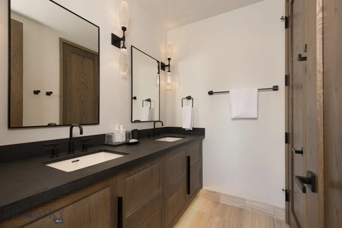 Bathroom featuring hardwood / wood-style flooring and vanity