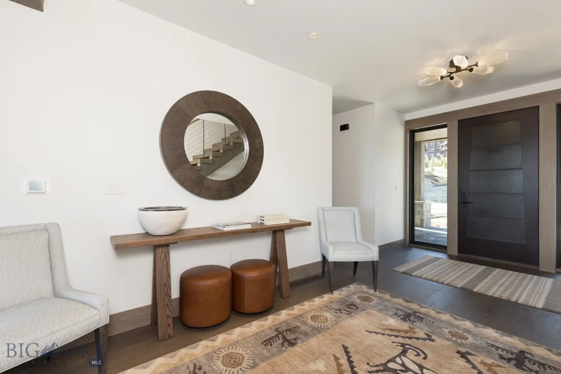 Foyer entrance with hardwood / wood-style floors