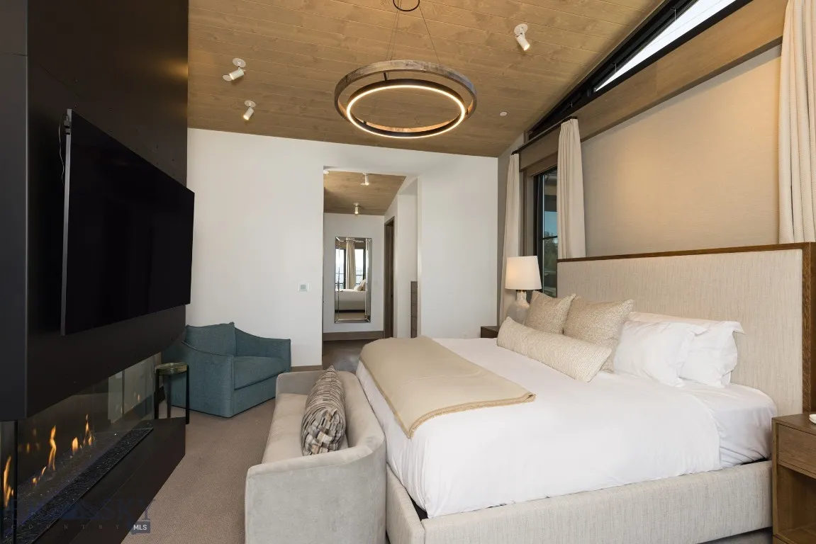Bedroom with carpet floors and wood ceiling