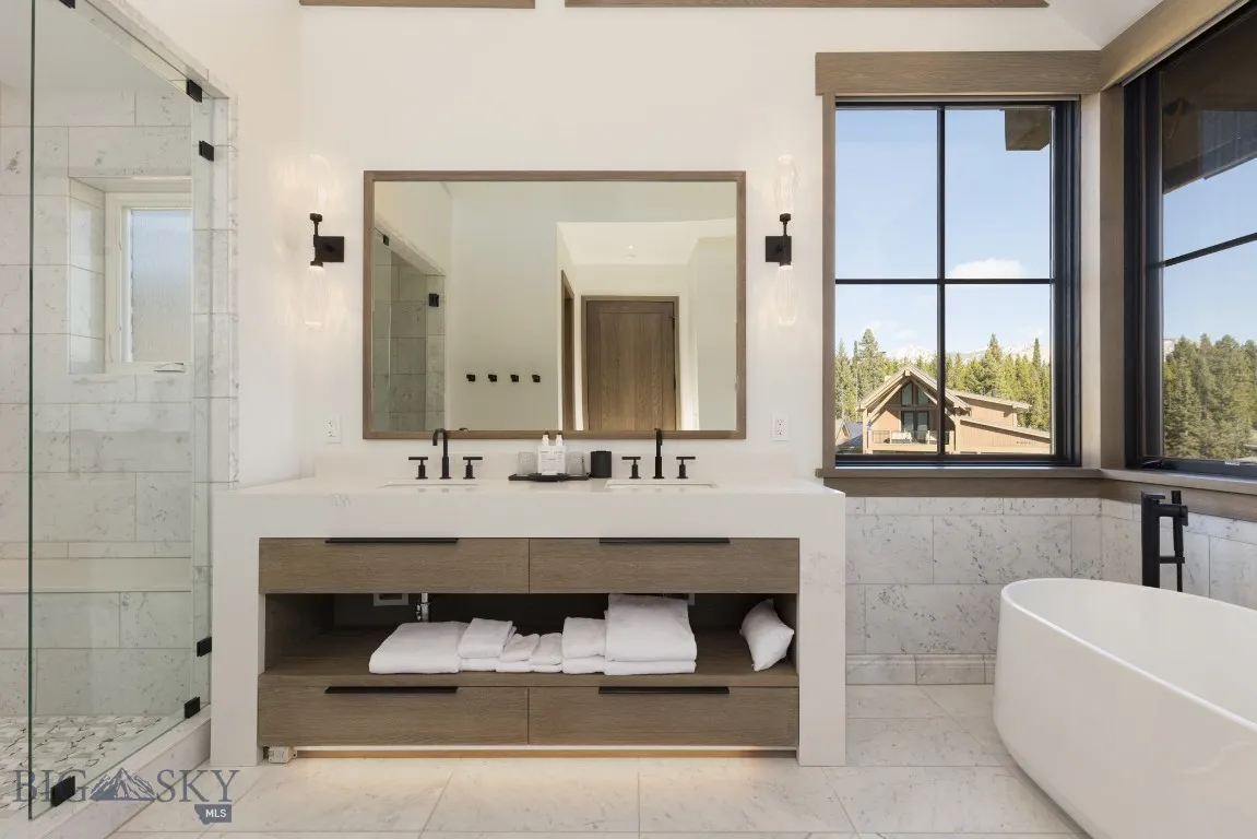 Bathroom with vanity and plus walk in shower
