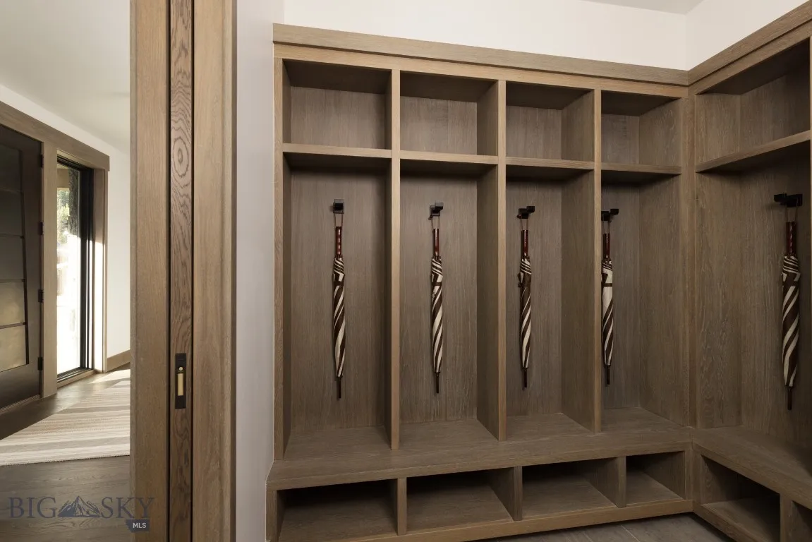 Mudroom featuring wood-type flooring