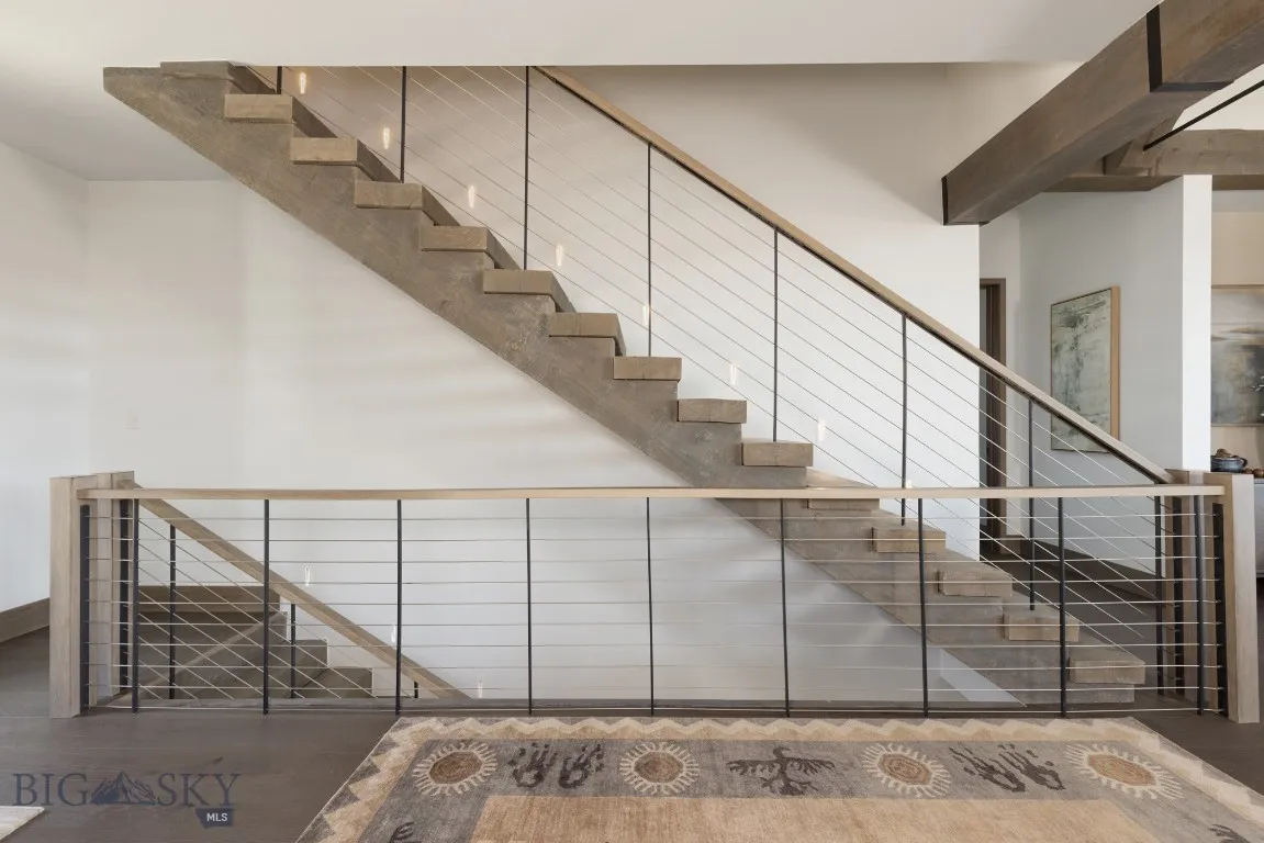Stairway with hardwood / wood-style flooring