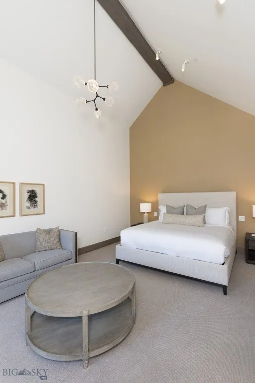 Bedroom with carpet flooring, beamed ceiling, high vaulted ceiling, and an inviting chandelier
