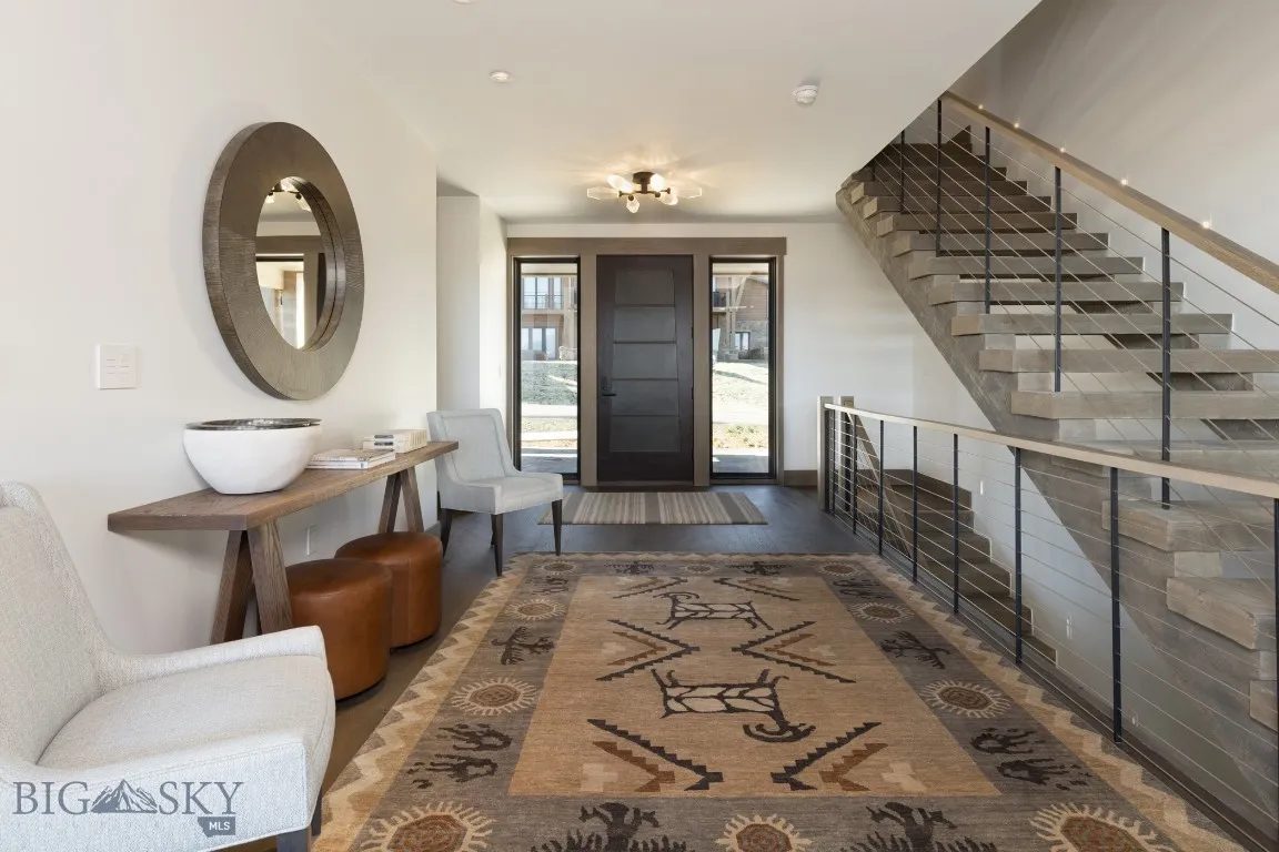Entrance foyer featuring dark wood-type flooring