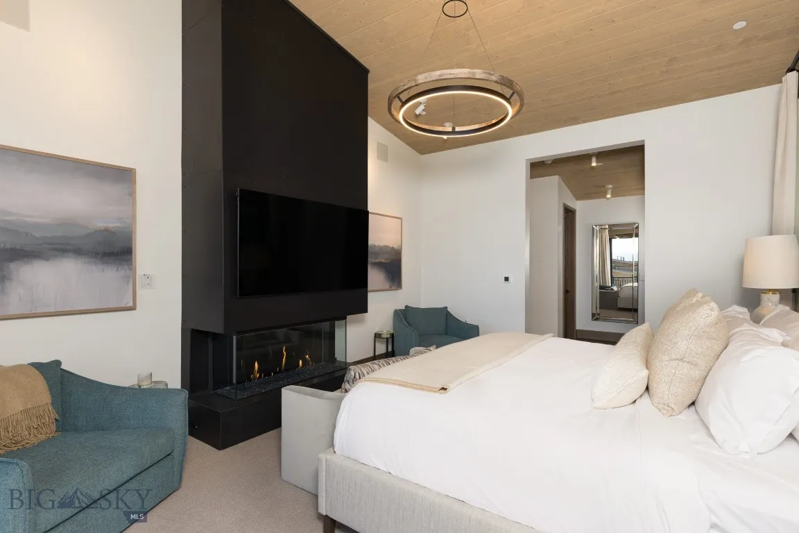 Carpeted bedroom with wooden ceiling