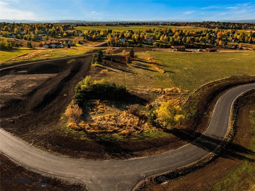Lot 17 benefits with direct access to the Sandhill community barn and playground.