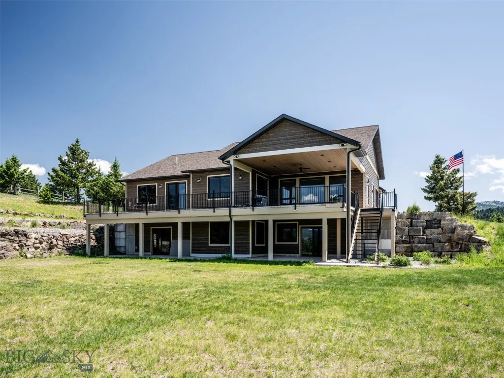 Rear of home with dual heated patios