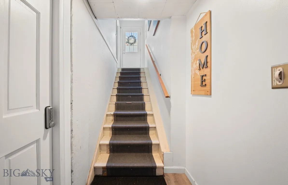 Door to garage, left, stairs to go up to apt