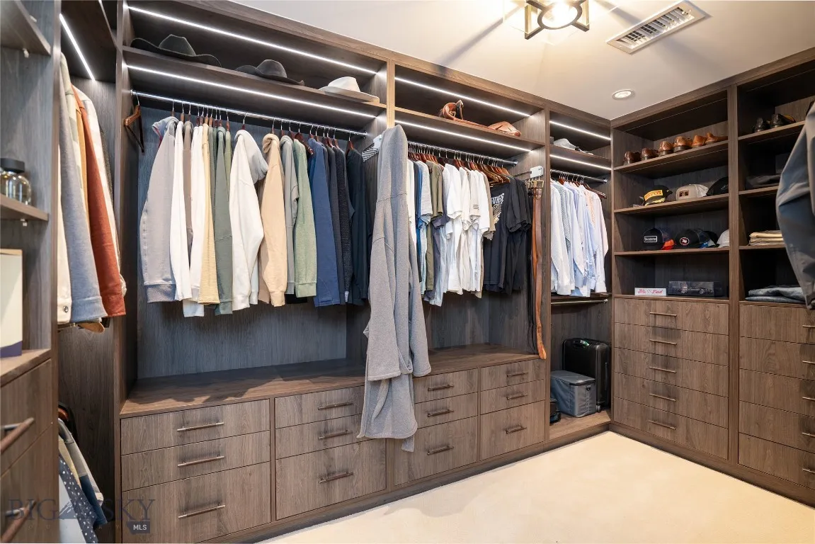 Dual Walk-in Closets with custom built-ins