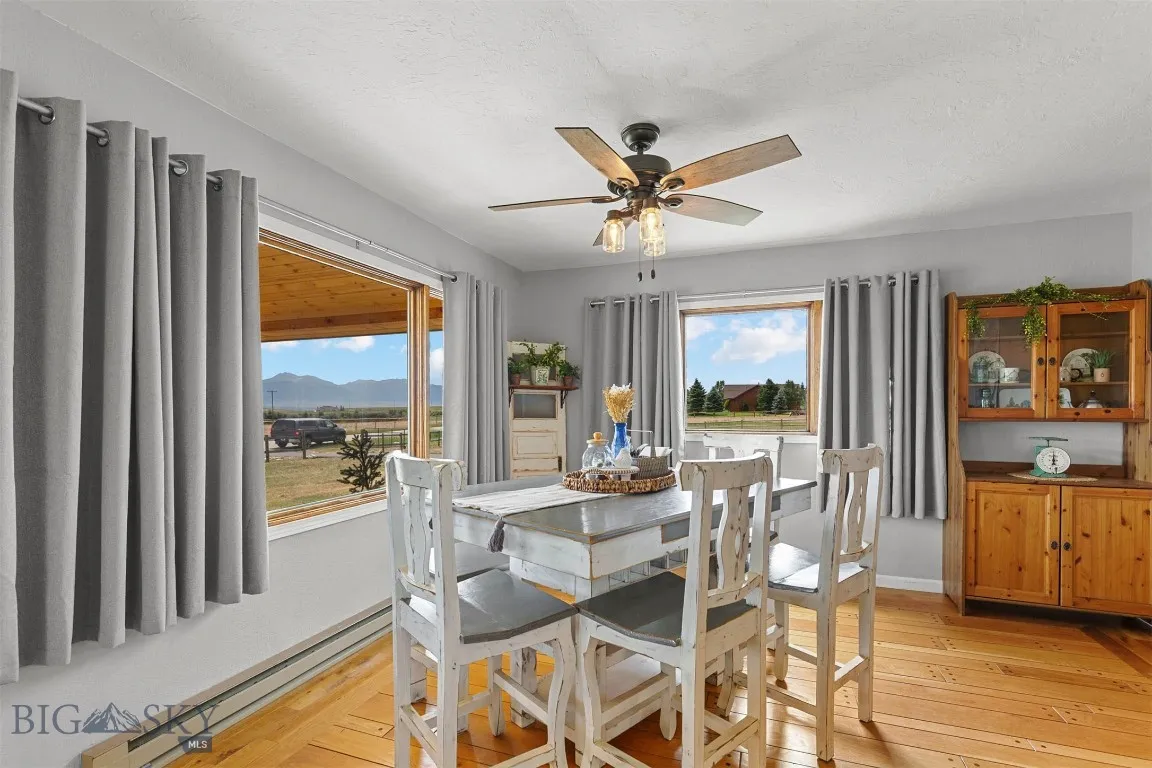 Dining area off the kitchen with scenic ranchland views.