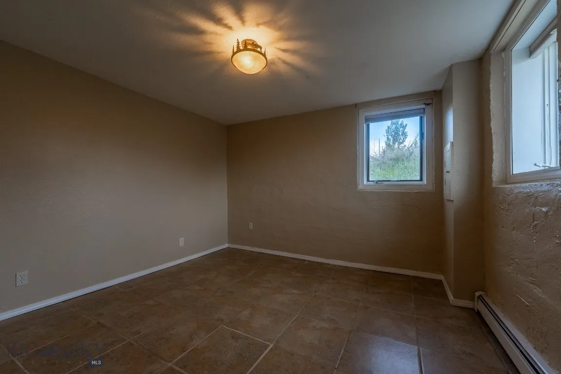 Lower level, non-conforming bedroom (no closet)