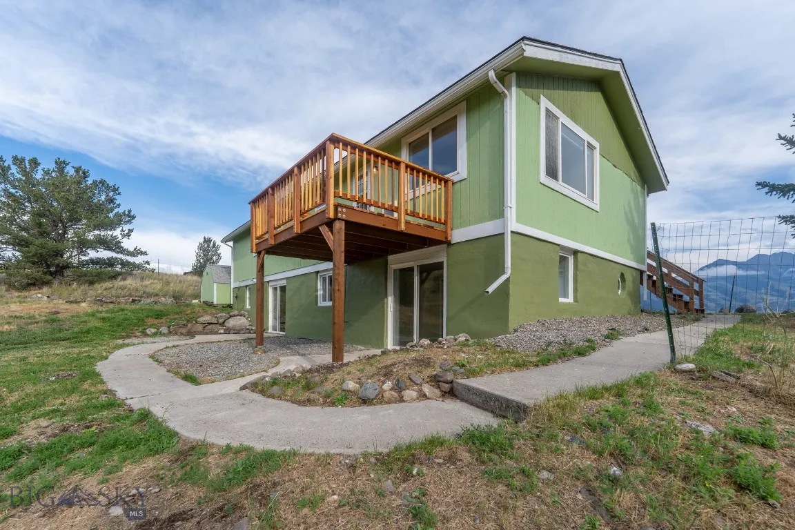 Exterior, sidewalk leads up to garage and front of home