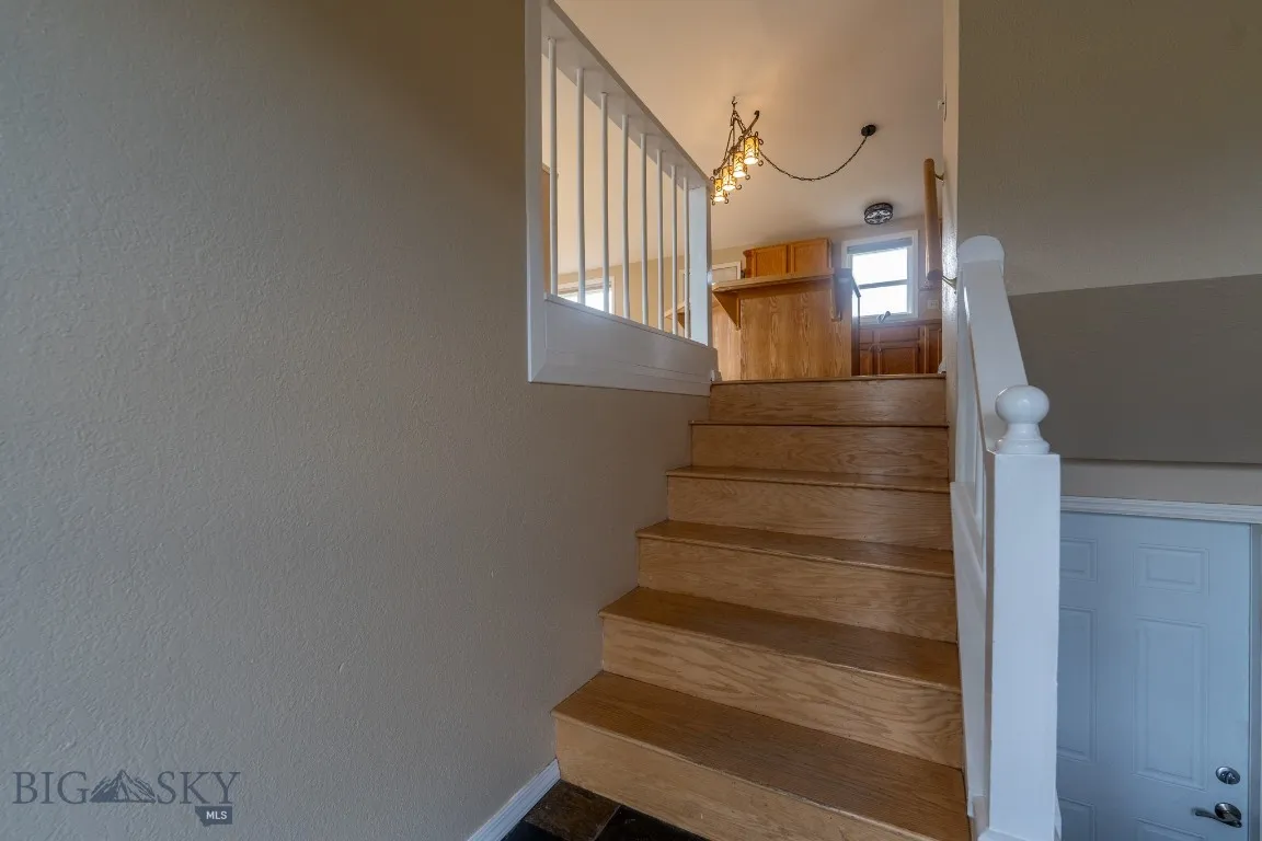 Upon entering, the stairs lead up and down to the two levels, main and below grade