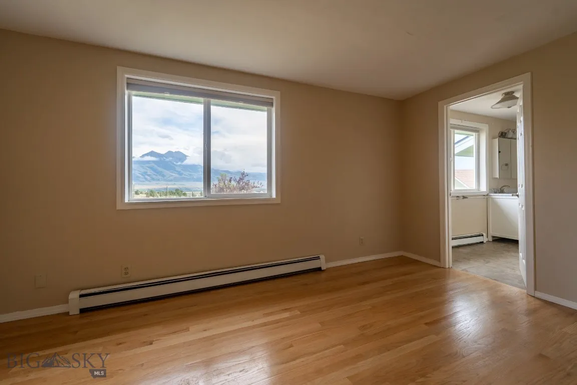 Main level, primary bedroom with en suite bathroom entry door