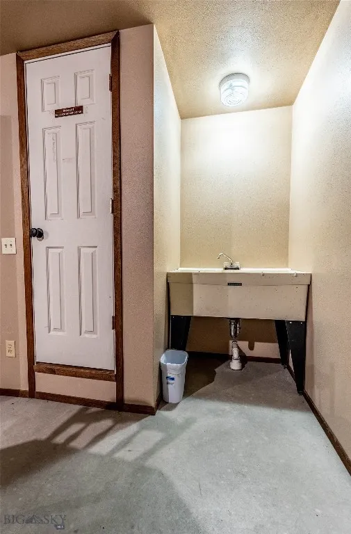 Utility Sink and Door to Crawlspace