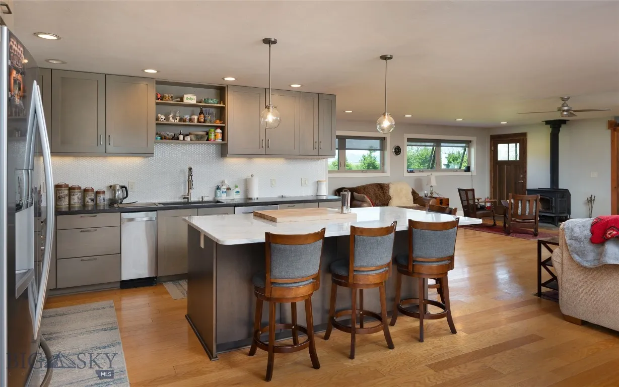 Granite and marble counters, trash compactor, open shelving