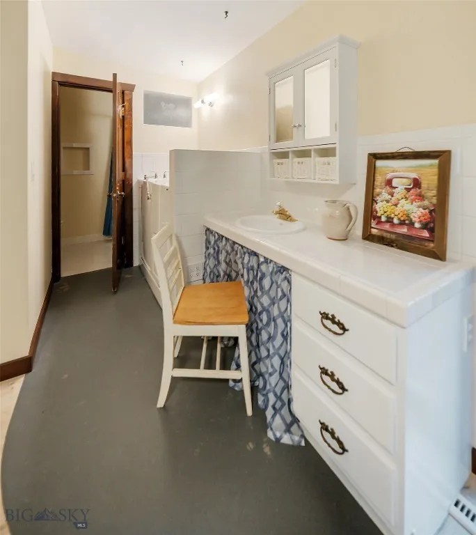 Primary bathroom with walk-in tub and shower