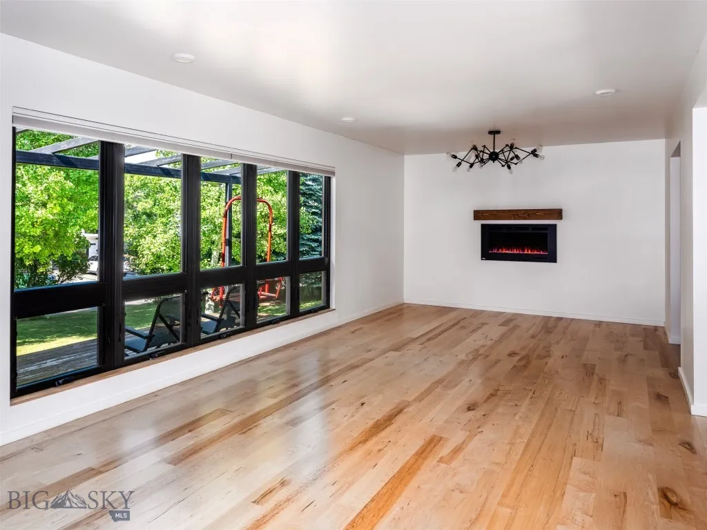 Wall of windows and LED wall fireplace