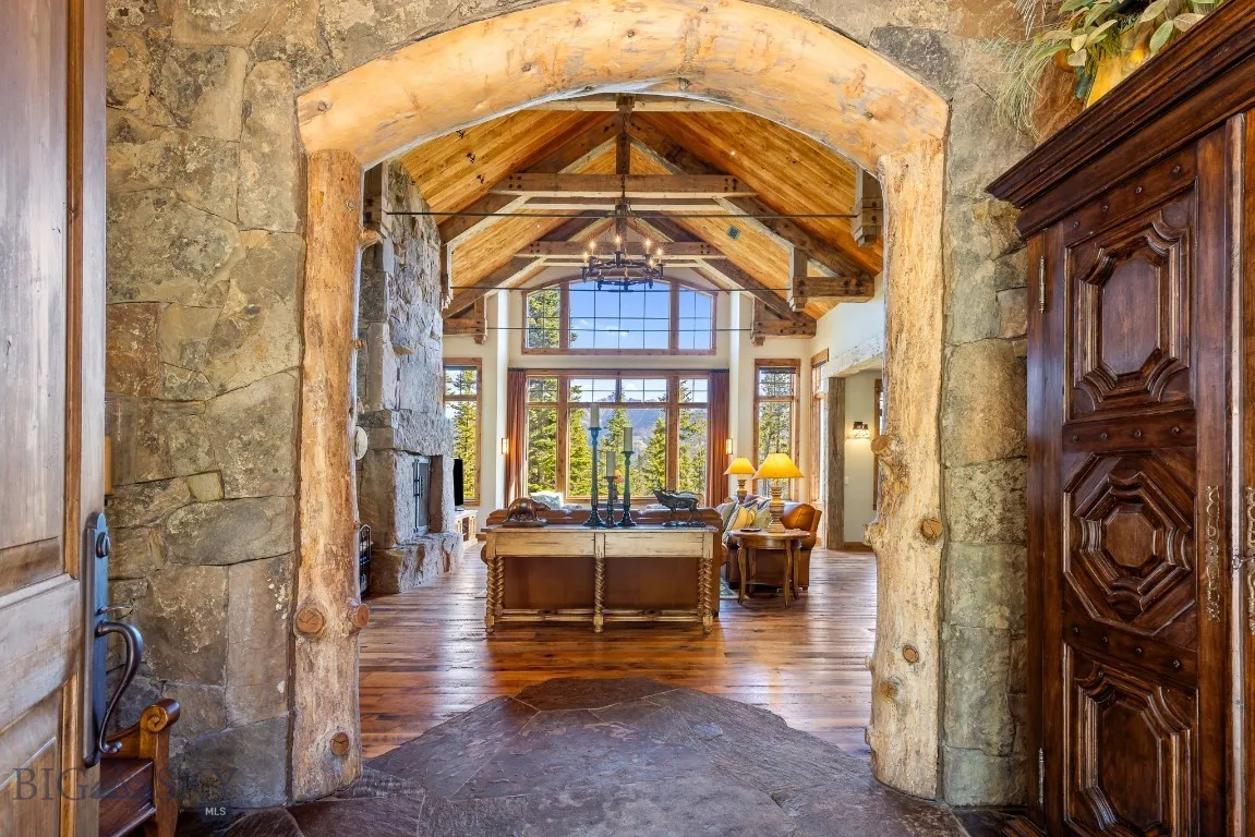 View of vaulted ceilings and grand living area from front entry