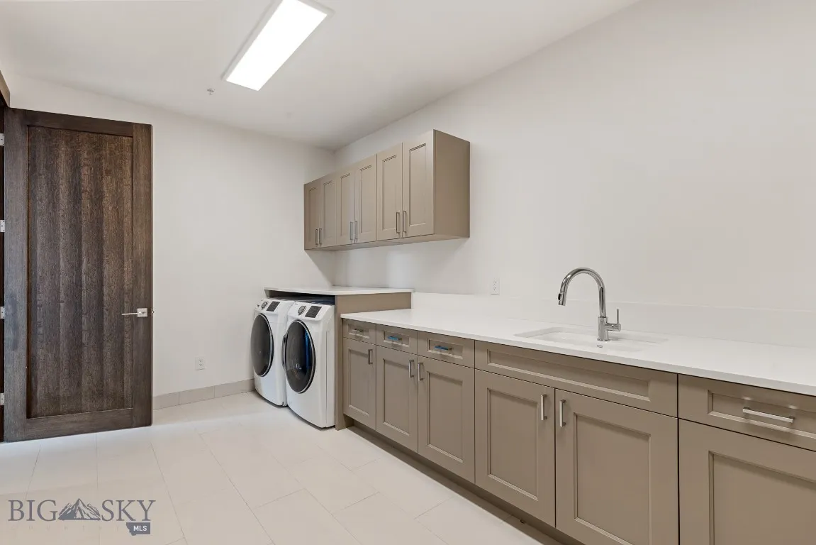 Lower Level huge Laundry Room with tons of storage space