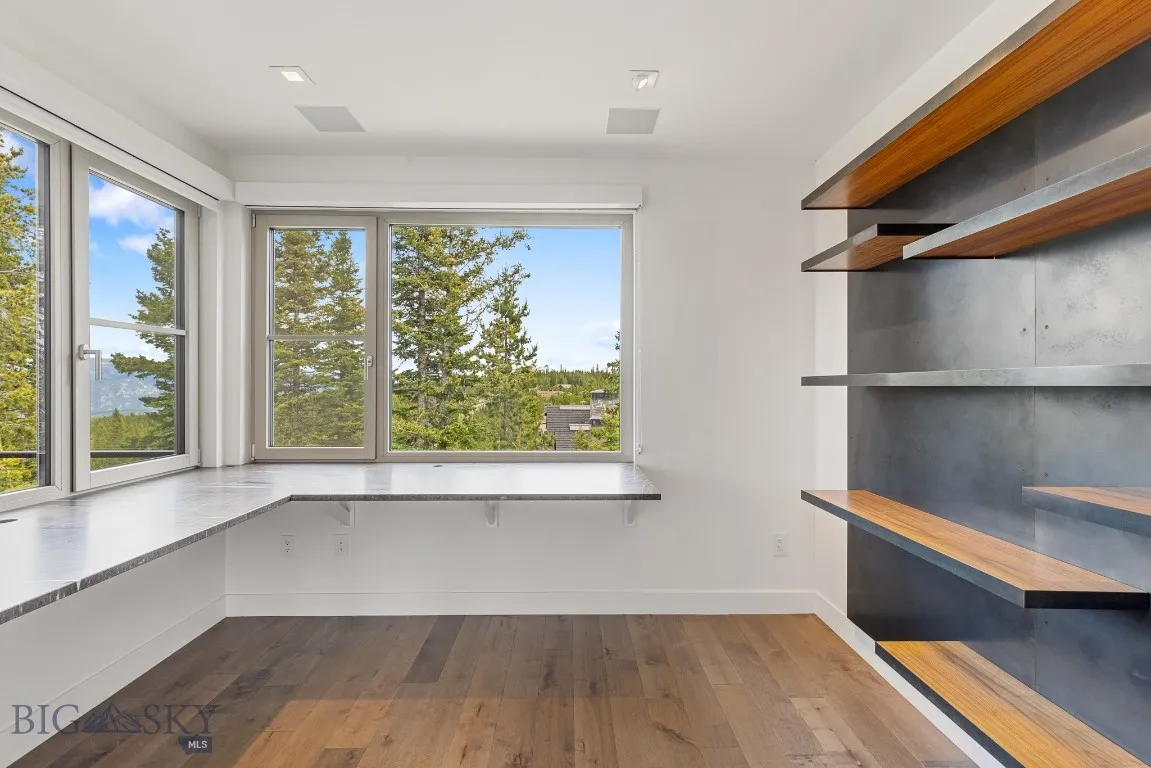 Main level office with custom steel shelving