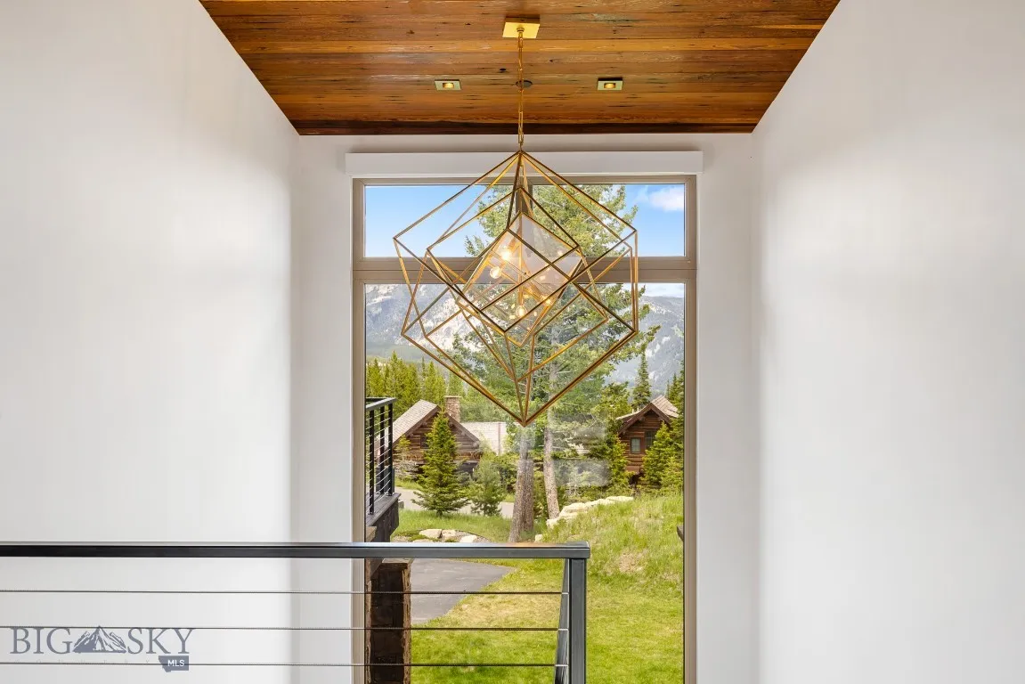 Fabulous Kelly Wearstler chandelier in the stairwell going to the lower level.