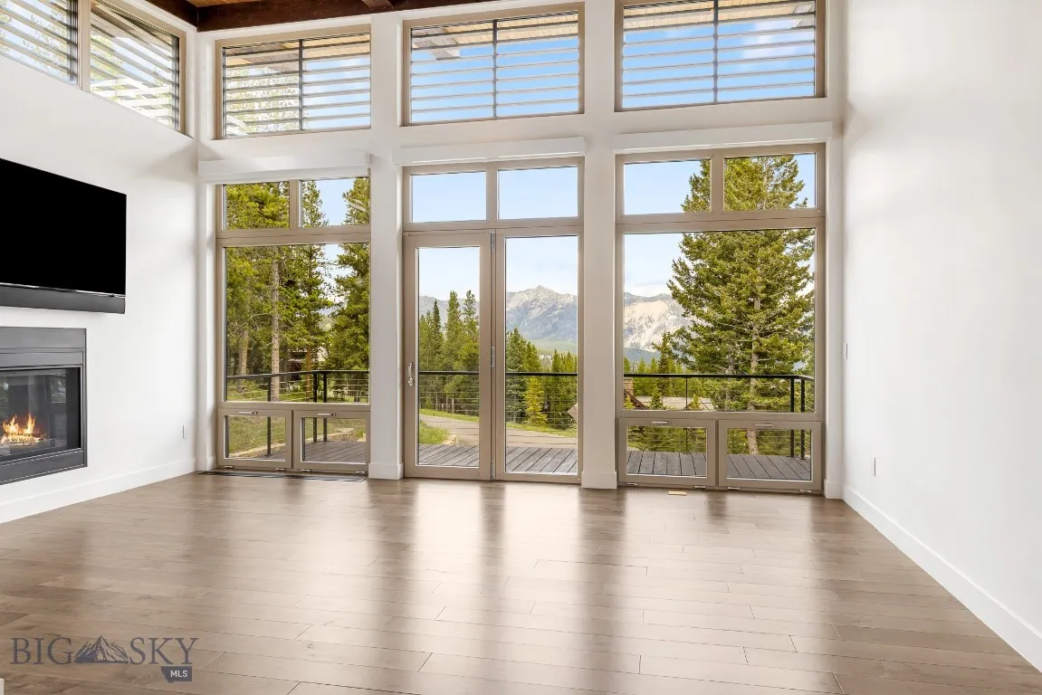 European UNILUX triple paned glass windows and sun filtering luevers frame the view and lend a stunning architectural detail.
