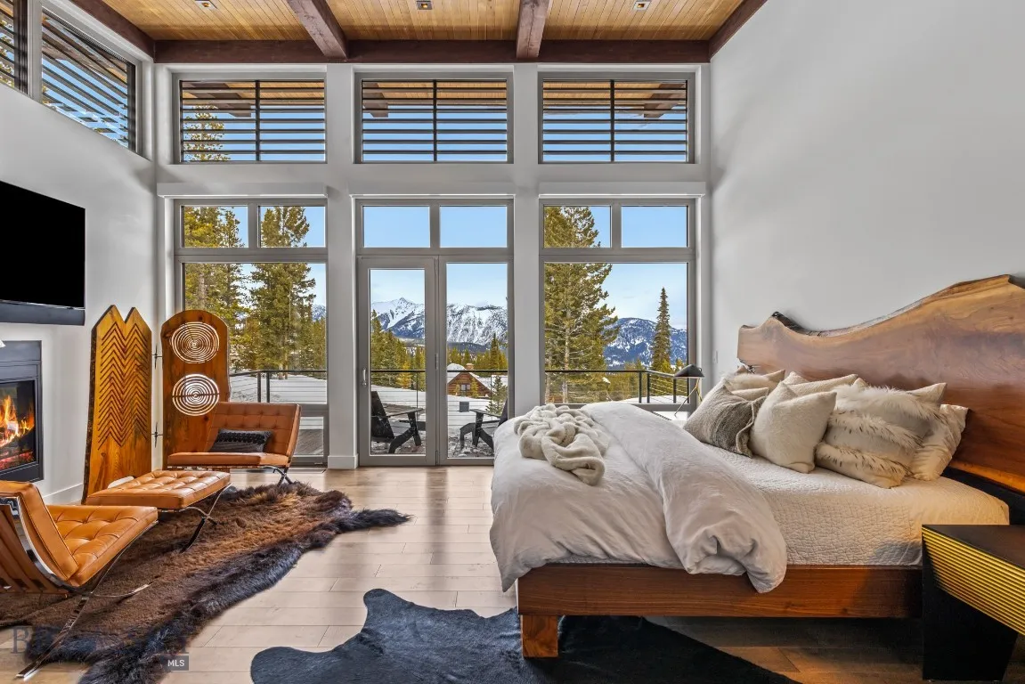 Previously furnished Primary Bedroom shows the private deck, the view and gas fireplace
