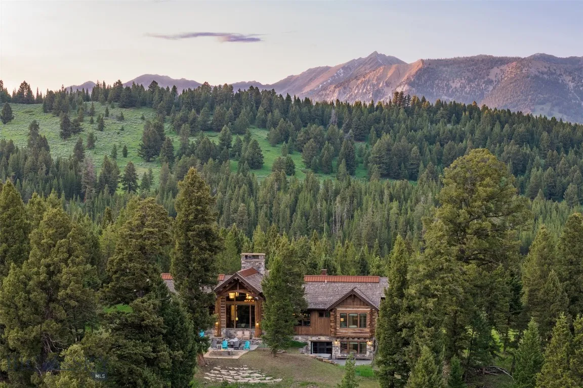 Secluded mountain retreat nestled in the forest with panoramic alpine views—offering unmatched privacy, natural beauty, and serene outdoor living.