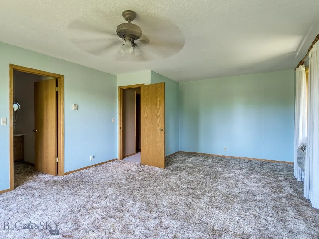 Master Bedroom far end and hall door. Plenty of space for sitting area or nursery.