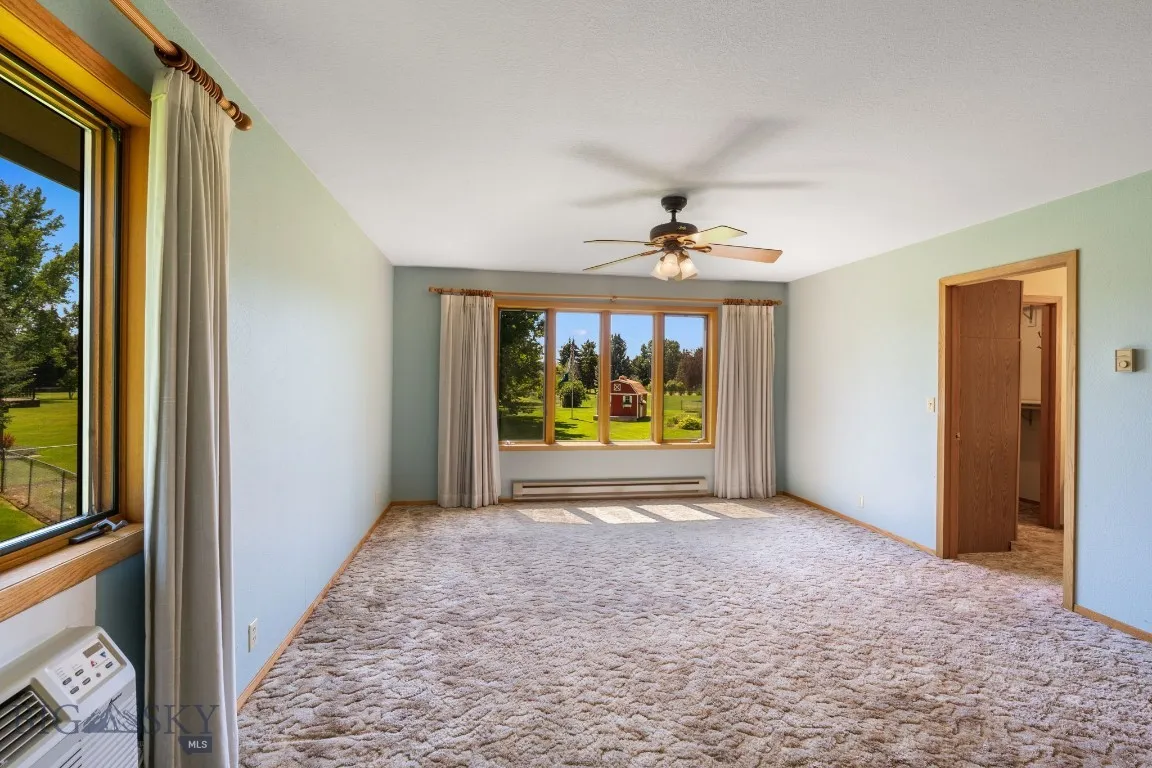 Long view of Master Bedroom and door to closet and bath.