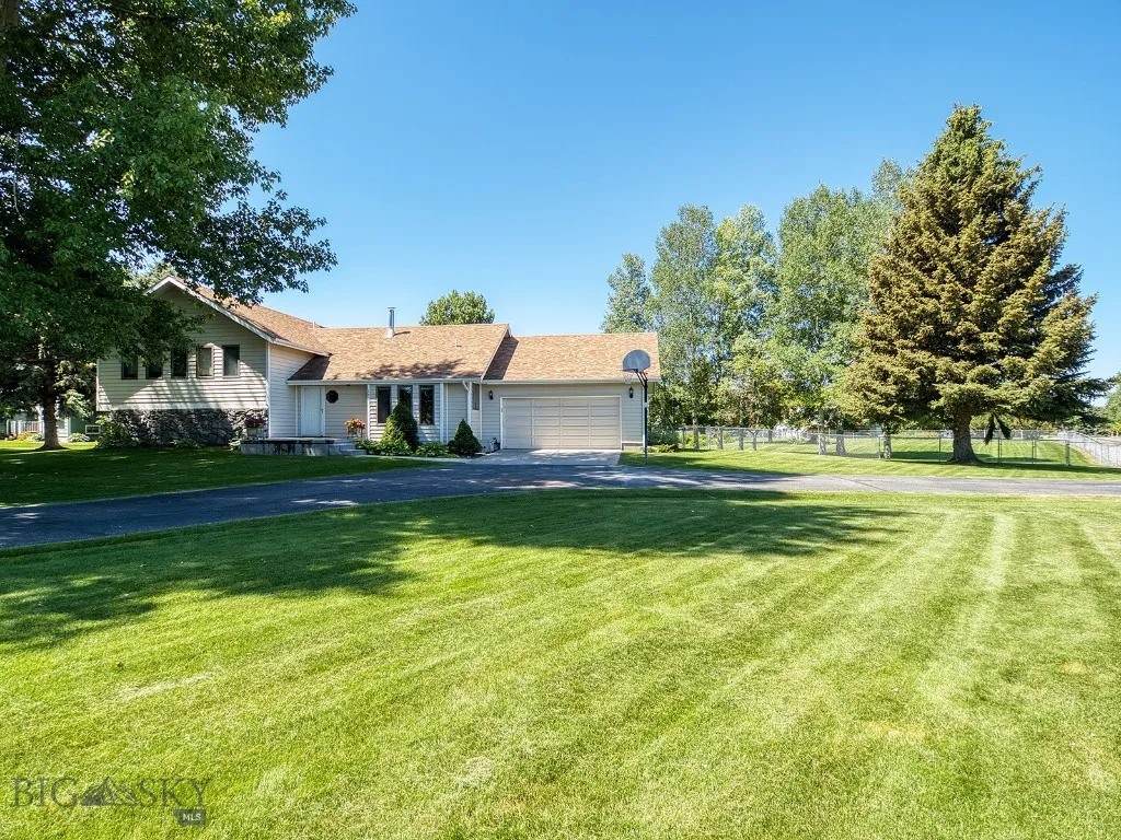 Large Conifers and Decidious trees Line the lot.