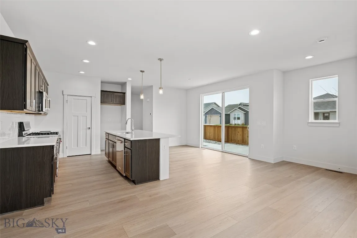 Open concept first floor living space with private side patio