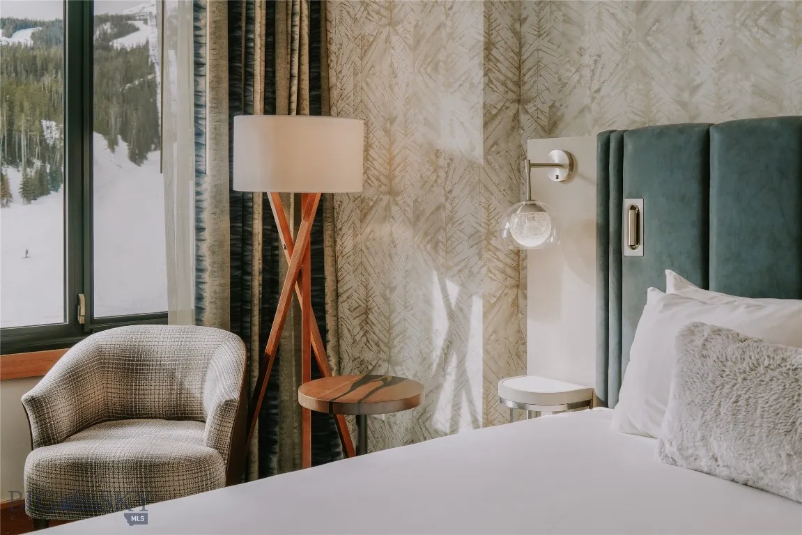 Thoughtful bedside design with built-in lighting, shelving, and convenient charging access.