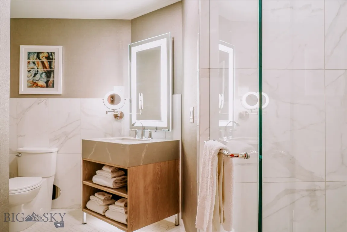 Contemporary bathroom with walk-in shower and modern finishes.