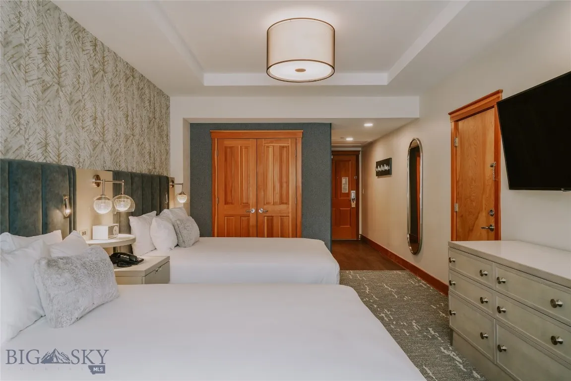 Guest suite entry showcasing warm wood finishes and modern mountain craftsmanship.