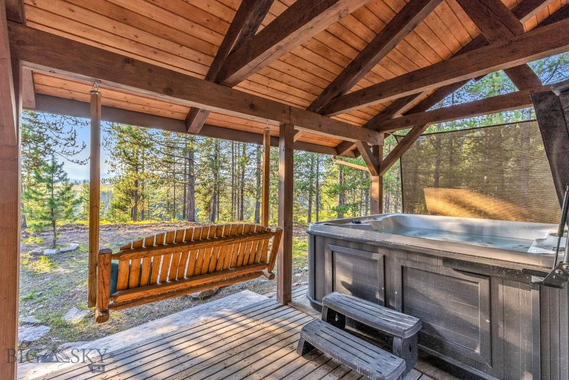 Private covered porch off of primary bedroom