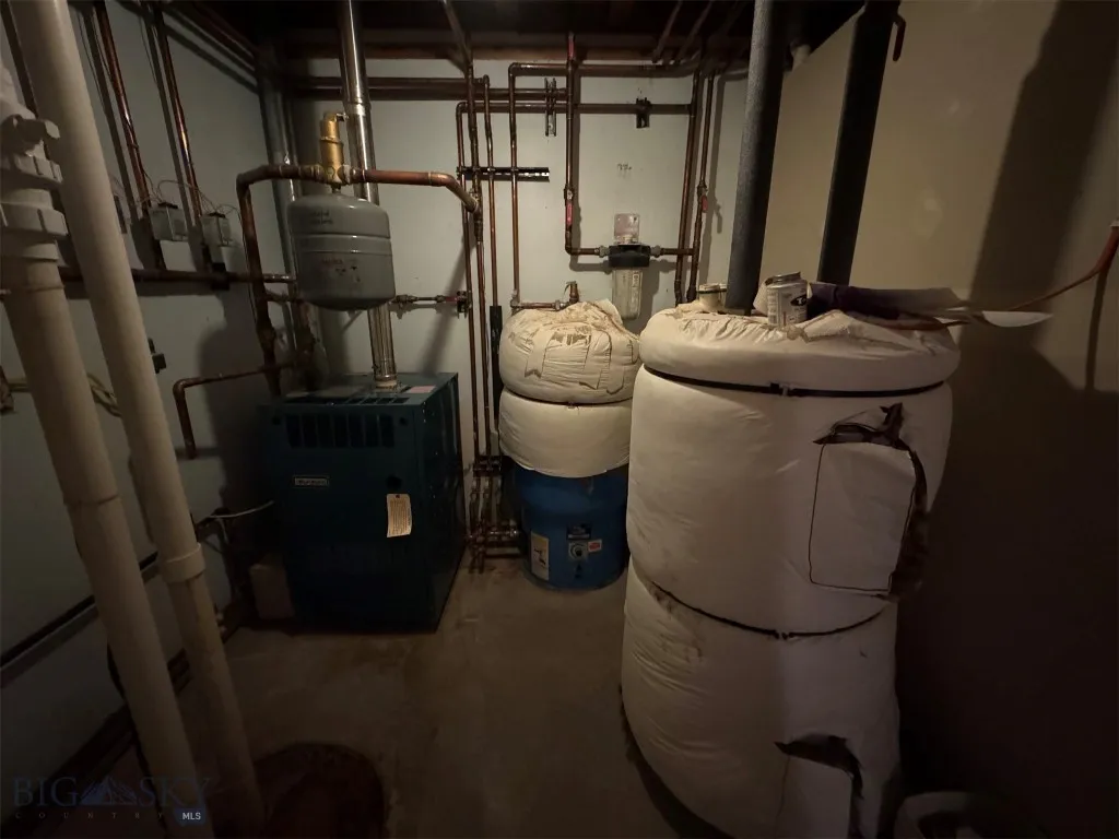 Utility room. Water softener is behind water heater.