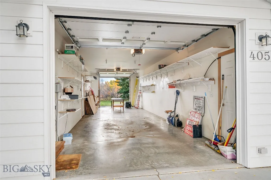 from south end, facing north overhead door; many shelves, insulated