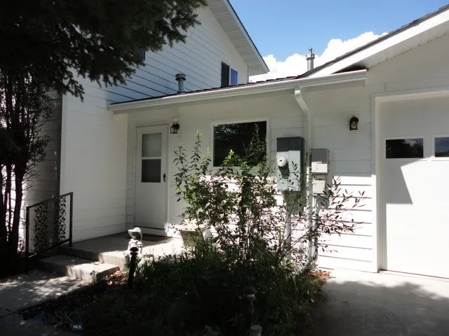 side entrance; to utility/mud room; facing south