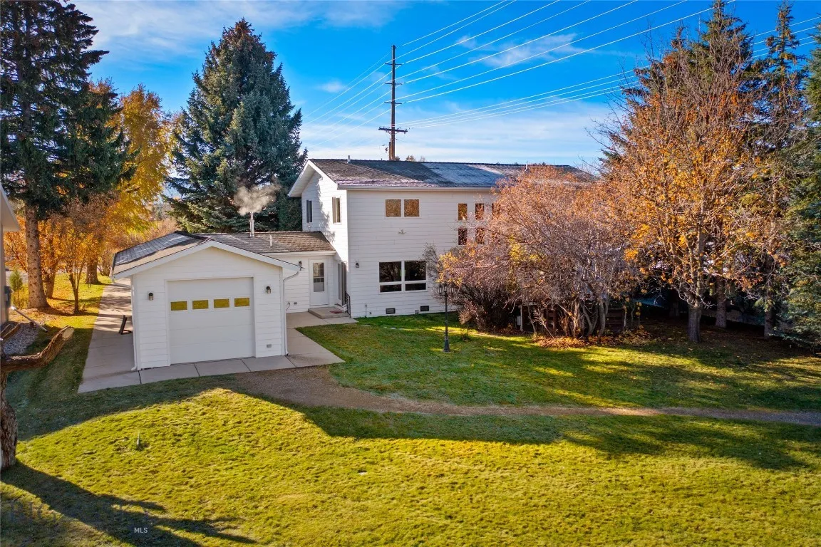 back yard of 1/3 ac prop: rear garage door,