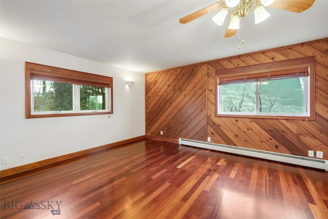 master bedroom; south-facing window & west wall