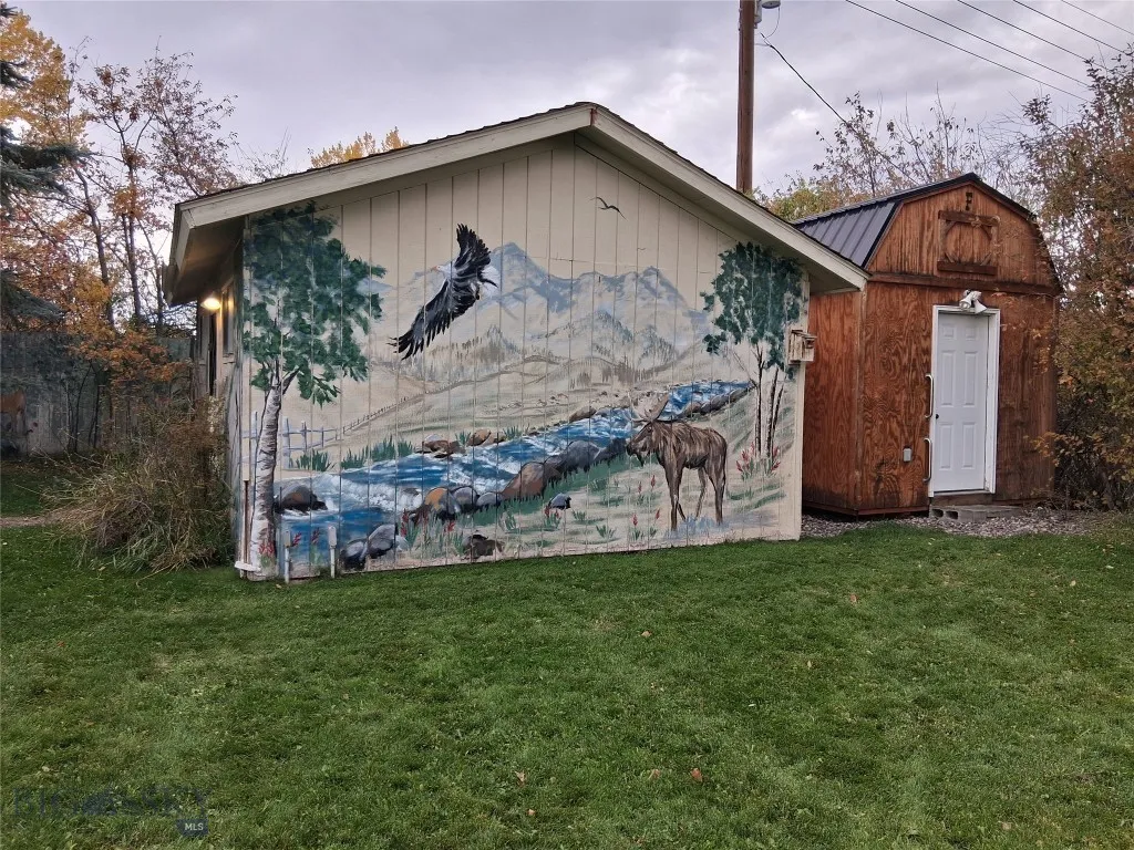2 large storage buildings; wildlife murals: east side of 1st building; 220 wiring & phone jack, another electrical sub-panel