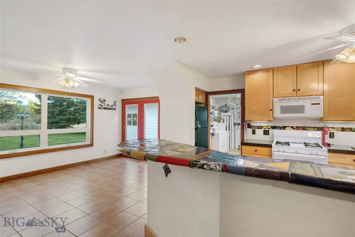 left to right: north window, patio door, door to utility room