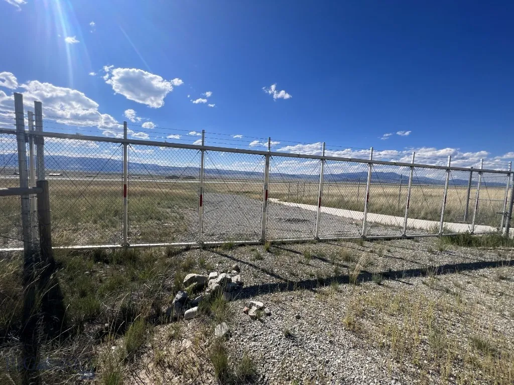 Gate to unimproved taxiway.