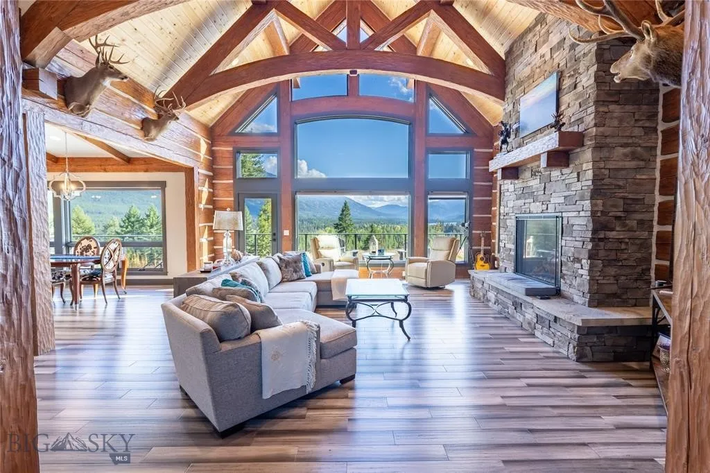 Great Room with fireplace, and large windows